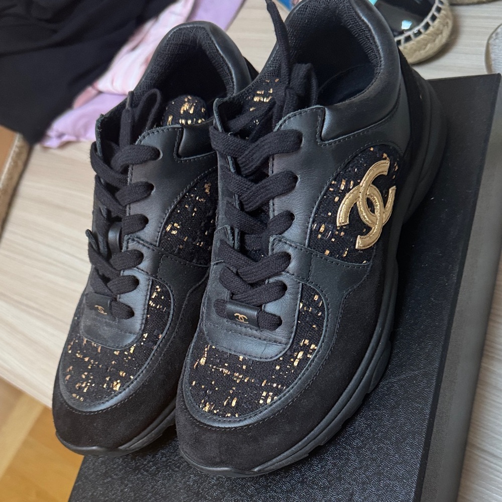CHANEL Women's Sneakers in Black and Gold